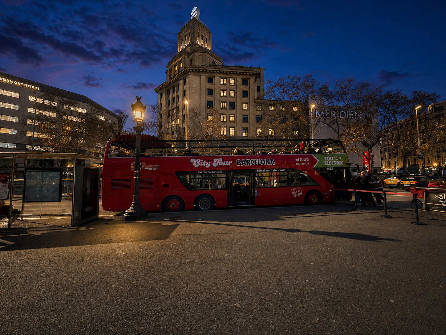 Plaça Catalunya at night and  Barcelona City Tour